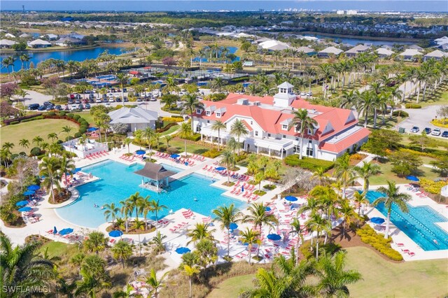 birds eye view of property with a water view