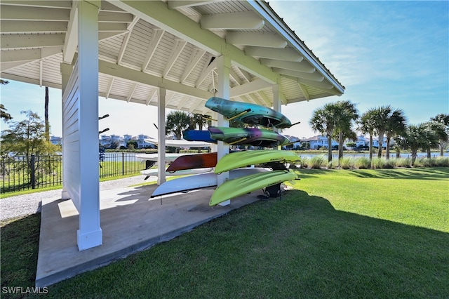 view of play area with fence and a lawn