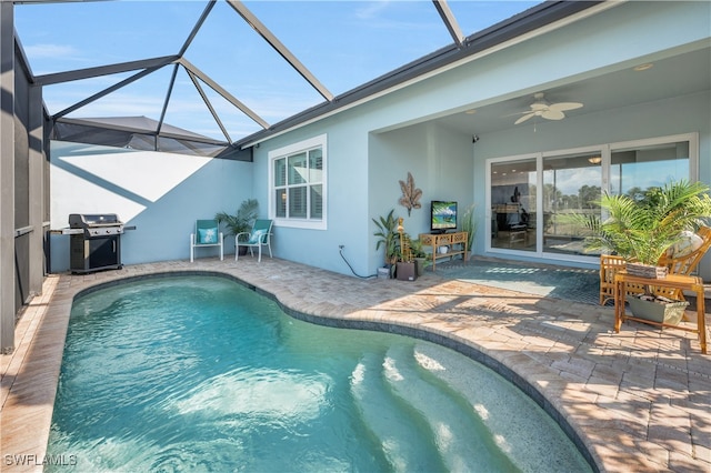 pool featuring a patio area, grilling area, a lanai, and a ceiling fan