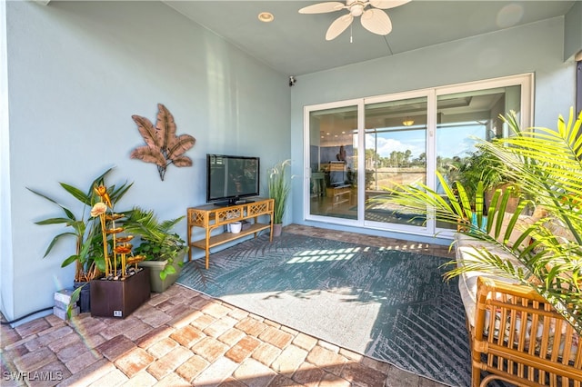 view of patio featuring ceiling fan