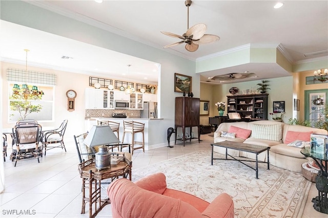 tiled living room featuring ceiling fan and ornamental molding