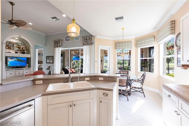 kitchen featuring sink, white cabinetry, decorative light fixtures, ornamental molding, and dishwasher