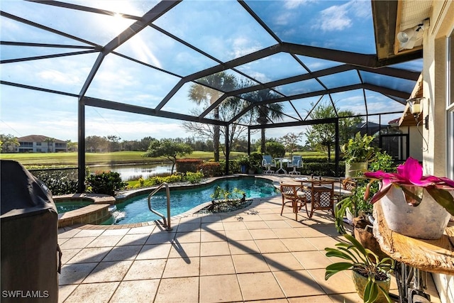 view of swimming pool featuring a water view, a patio, a lanai, and an in ground hot tub