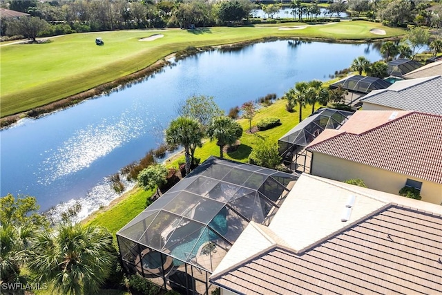 birds eye view of property with a water view