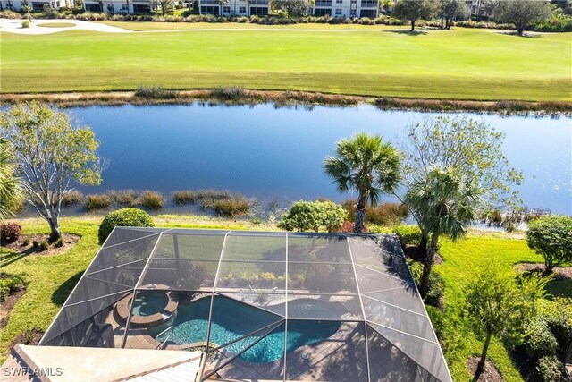 birds eye view of property with a water view