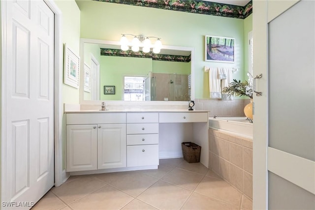 bathroom featuring vanity, plus walk in shower, and tile patterned flooring