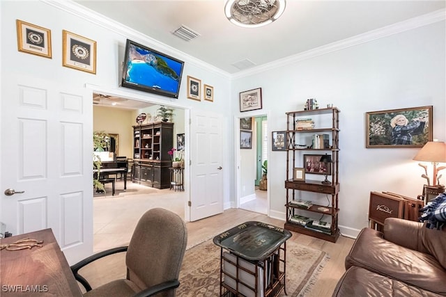 living room with ornamental molding and light wood-type flooring