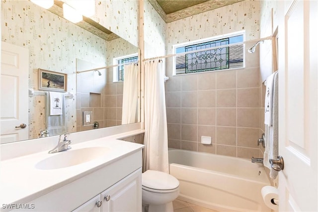 full bathroom with shower / tub combo with curtain, vanity, tile patterned floors, and toilet