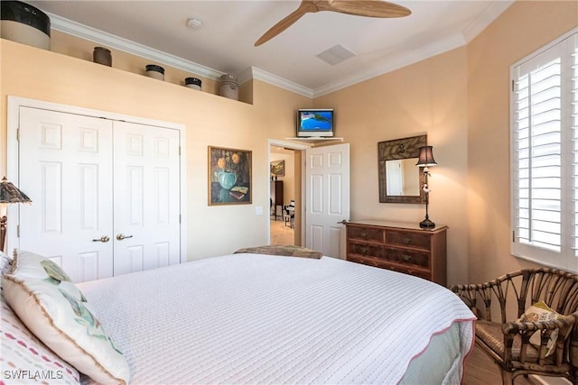 bedroom with multiple windows, crown molding, a closet, and ceiling fan