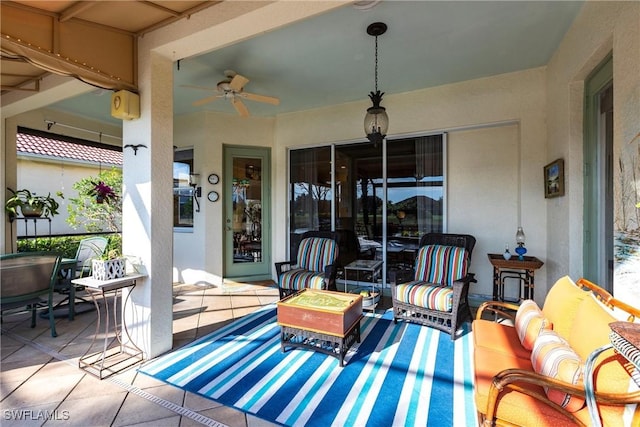 view of patio / terrace featuring ceiling fan and an outdoor living space