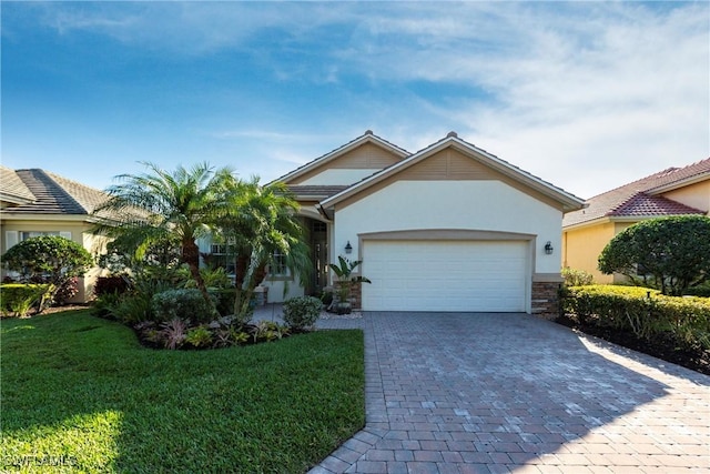 view of front of home with a garage and a front yard