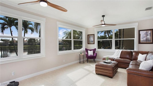 sunroom featuring visible vents and a ceiling fan