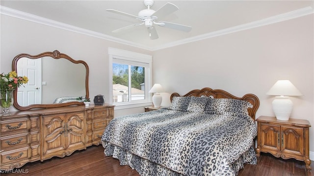 bedroom with ornamental molding, a ceiling fan, and wood finished floors