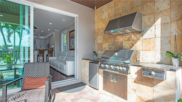 view of patio / terrace featuring a sink, grilling area, and exterior kitchen