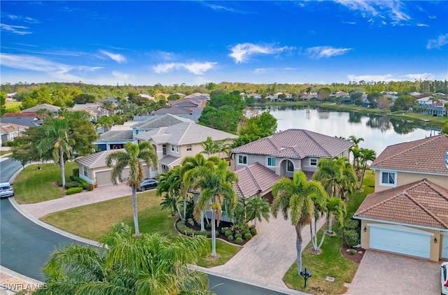 bird's eye view featuring a residential view and a water view