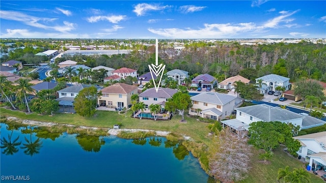 bird's eye view with a residential view and a water view