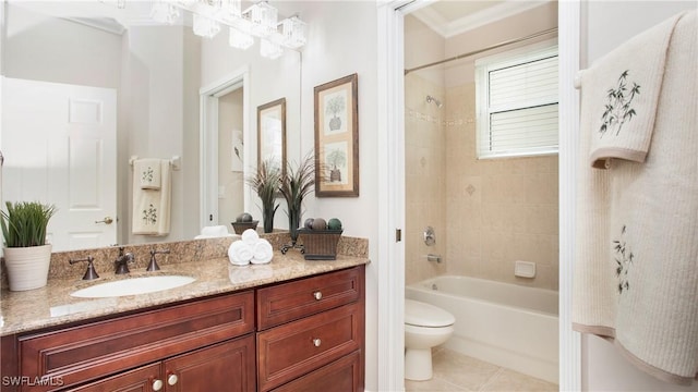 full bathroom with tile patterned flooring, toilet, ornamental molding, bathtub / shower combination, and vanity