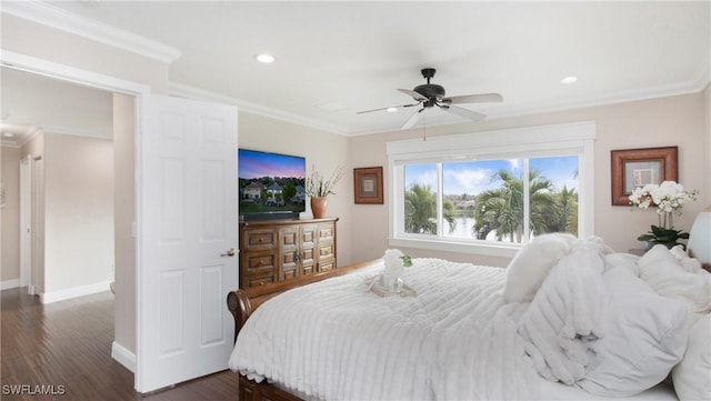 bedroom with recessed lighting, crown molding, and dark wood-type flooring