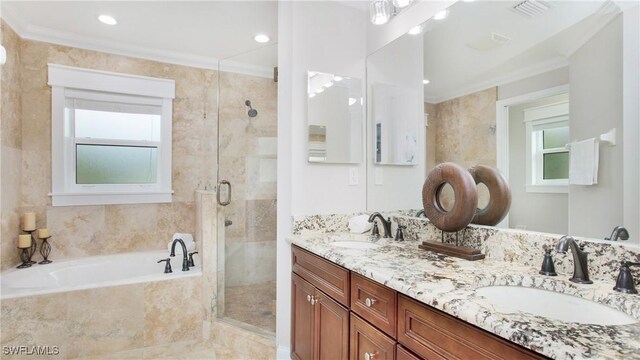 full bathroom with a sink, ornamental molding, a stall shower, and visible vents