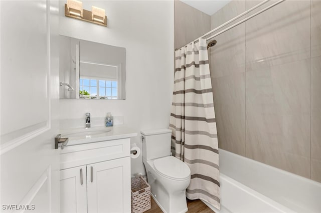 full bathroom featuring shower / tub combo with curtain, vanity, and toilet