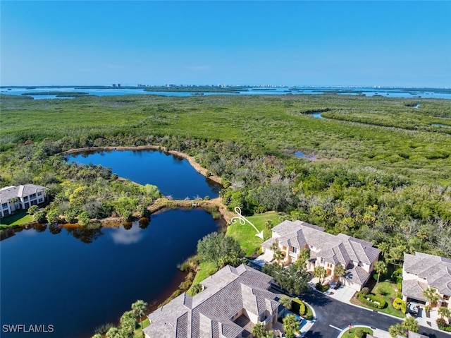 birds eye view of property featuring a water view