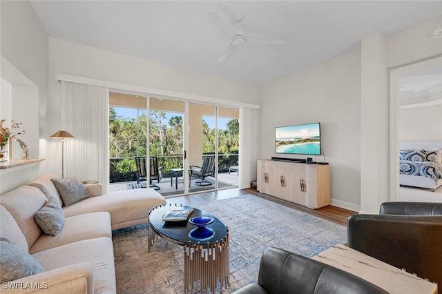 living room with hardwood / wood-style flooring and ceiling fan