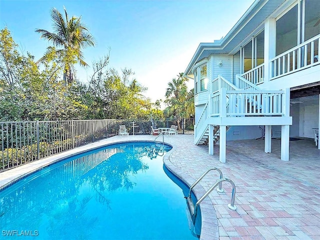 view of swimming pool with a patio area