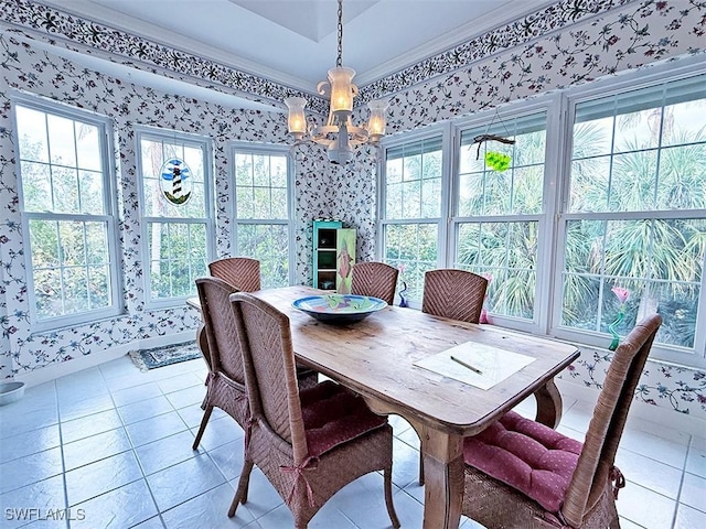 dining room featuring ornamental molding, light tile patterned floors, and an inviting chandelier