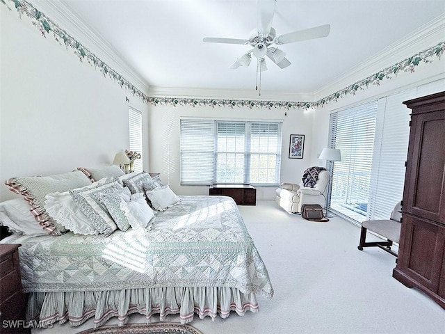 bedroom featuring crown molding, carpet floors, and ceiling fan