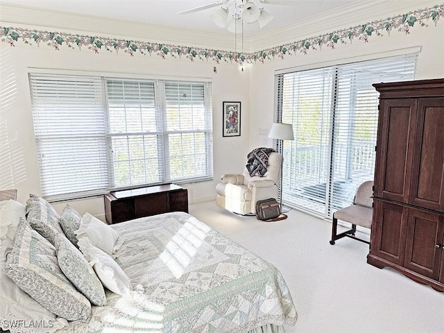 bedroom featuring ornamental molding, light carpet, access to exterior, and ceiling fan