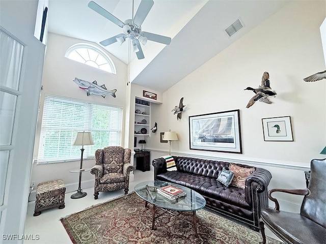 living room with high vaulted ceiling and ceiling fan