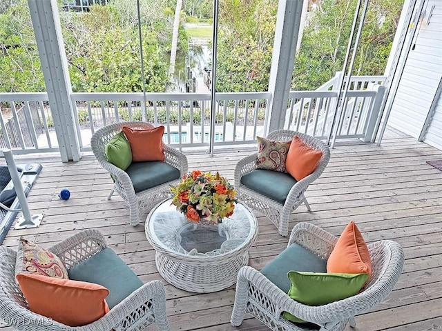 sunroom / solarium featuring a healthy amount of sunlight