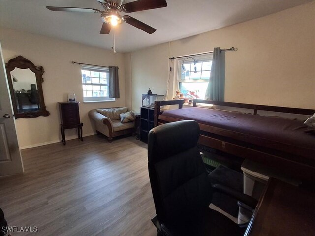 bedroom with hardwood / wood-style flooring and ceiling fan