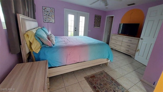 tiled bedroom with french doors