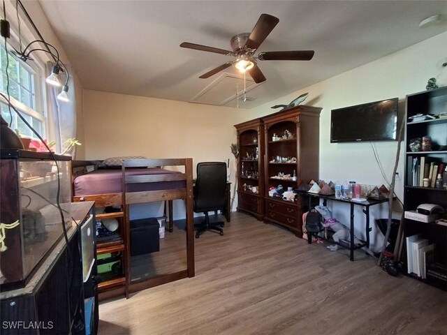 bedroom featuring hardwood / wood-style flooring and ceiling fan