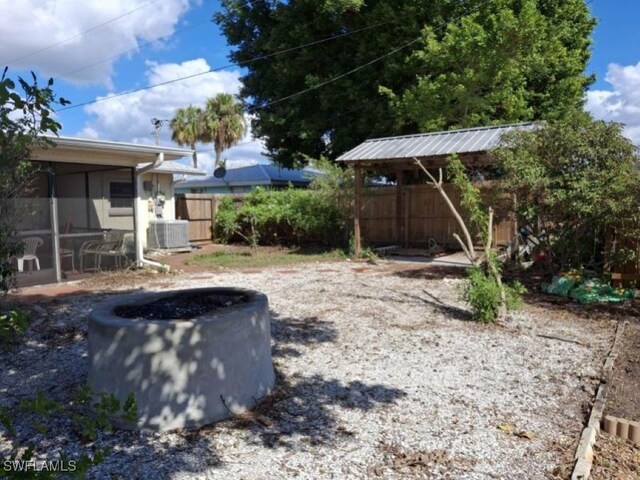 view of yard featuring central air condition unit