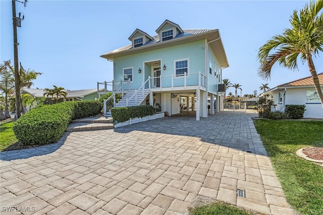 view of front of house with a carport and a porch