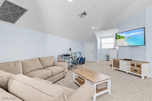 carpeted living room with vaulted ceiling