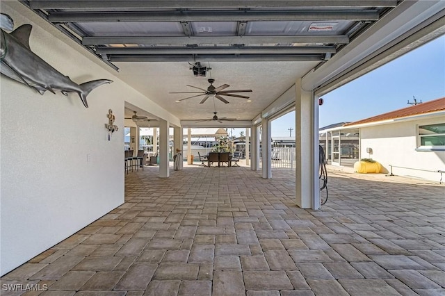 view of patio featuring ceiling fan