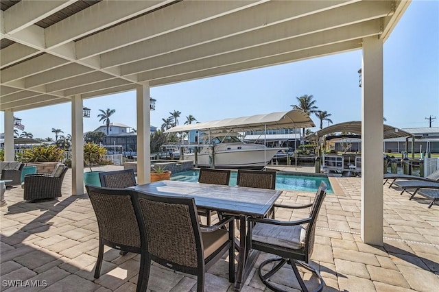 view of patio / terrace with a boat dock