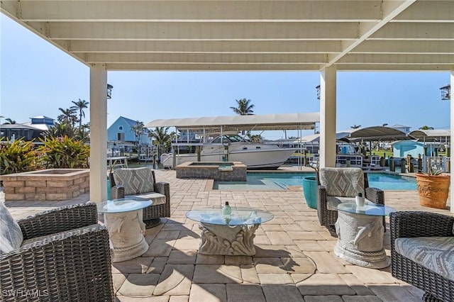 view of patio / terrace featuring an in ground hot tub