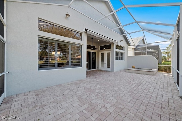 unfurnished sunroom featuring lofted ceiling