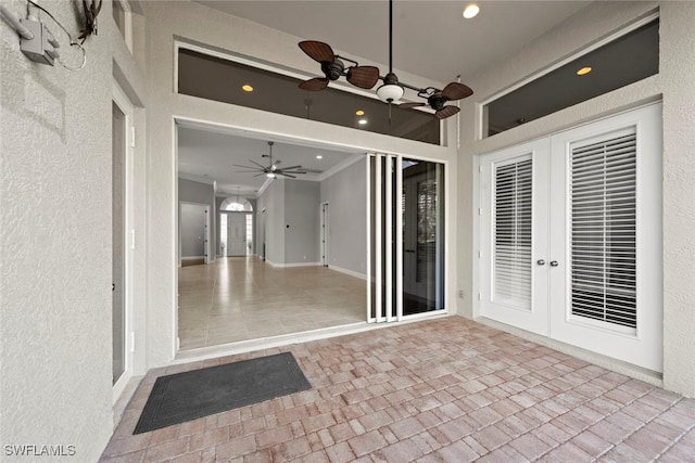 interior space featuring french doors and ceiling fan