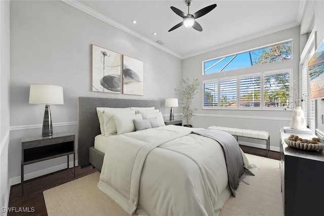 bedroom featuring hardwood / wood-style flooring, crown molding, and ceiling fan