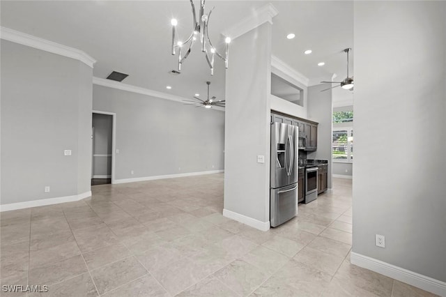 kitchen with ornamental molding, appliances with stainless steel finishes, and ceiling fan with notable chandelier