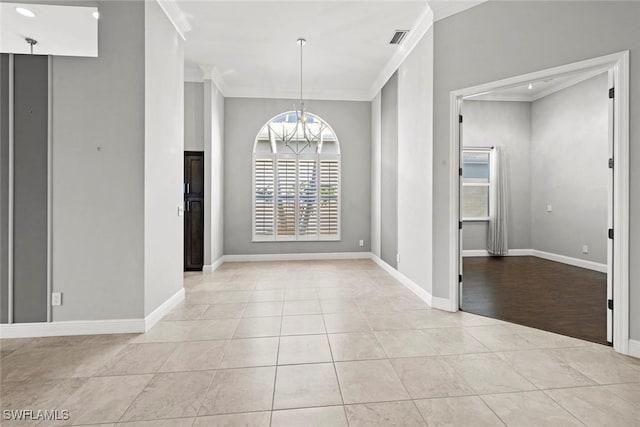 unfurnished dining area with ornamental molding, light tile patterned floors, and a notable chandelier