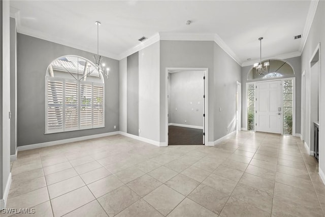 foyer entrance featuring an inviting chandelier, ornamental molding, and light tile patterned floors