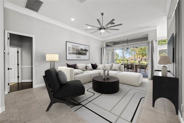 tiled living room featuring ornamental molding and ceiling fan