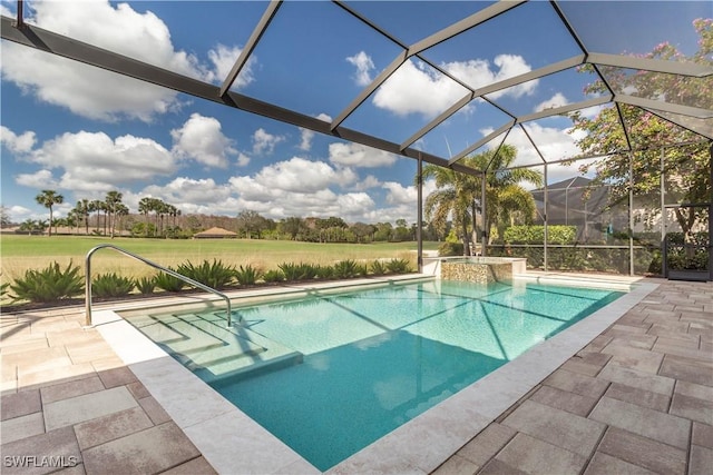 view of pool featuring glass enclosure and a patio area