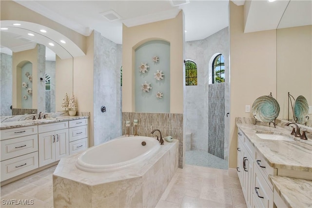 bathroom with ornamental molding, vanity, and separate shower and tub